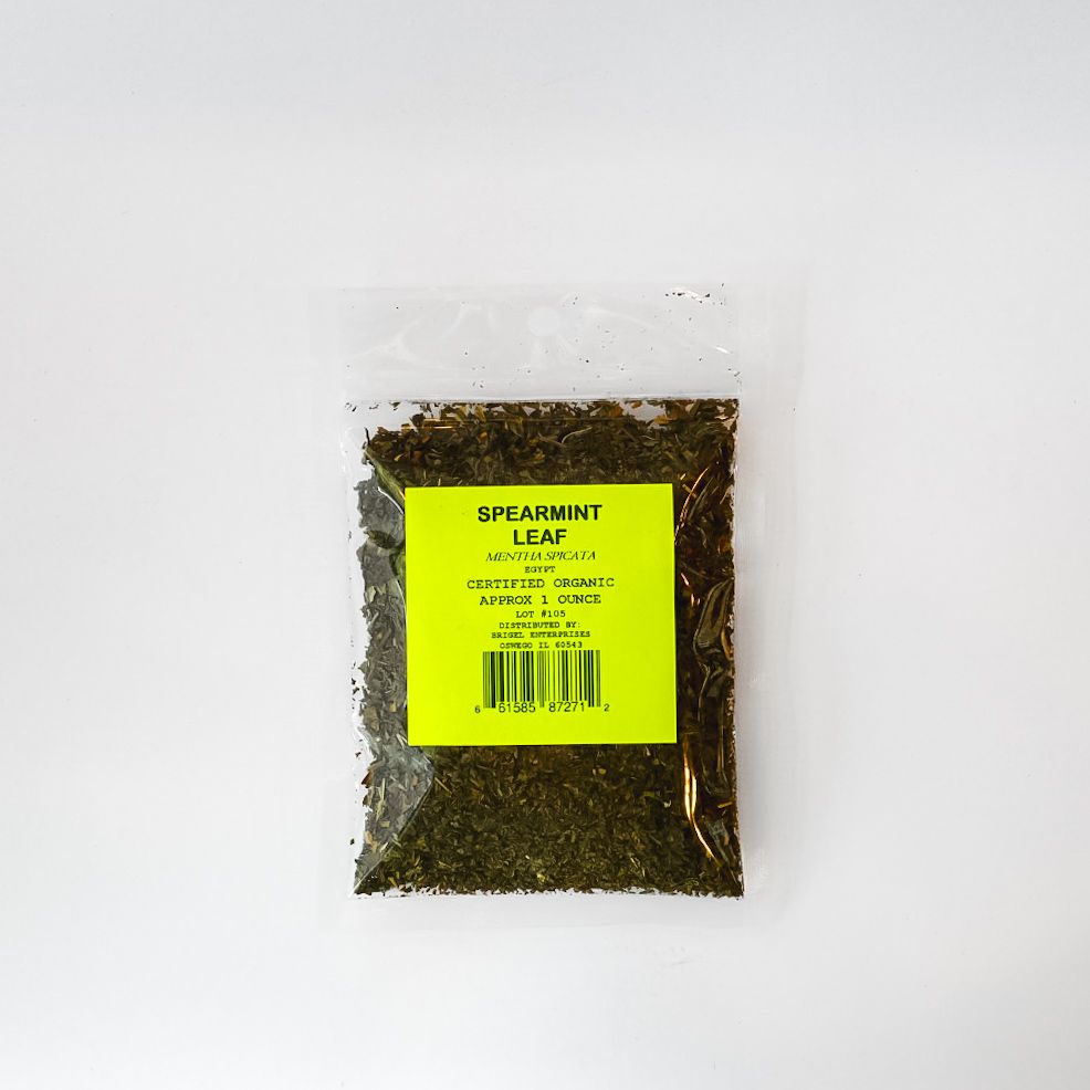 Clear plastic pouch of dried spearmint leaves with a bright yellow label on a white background