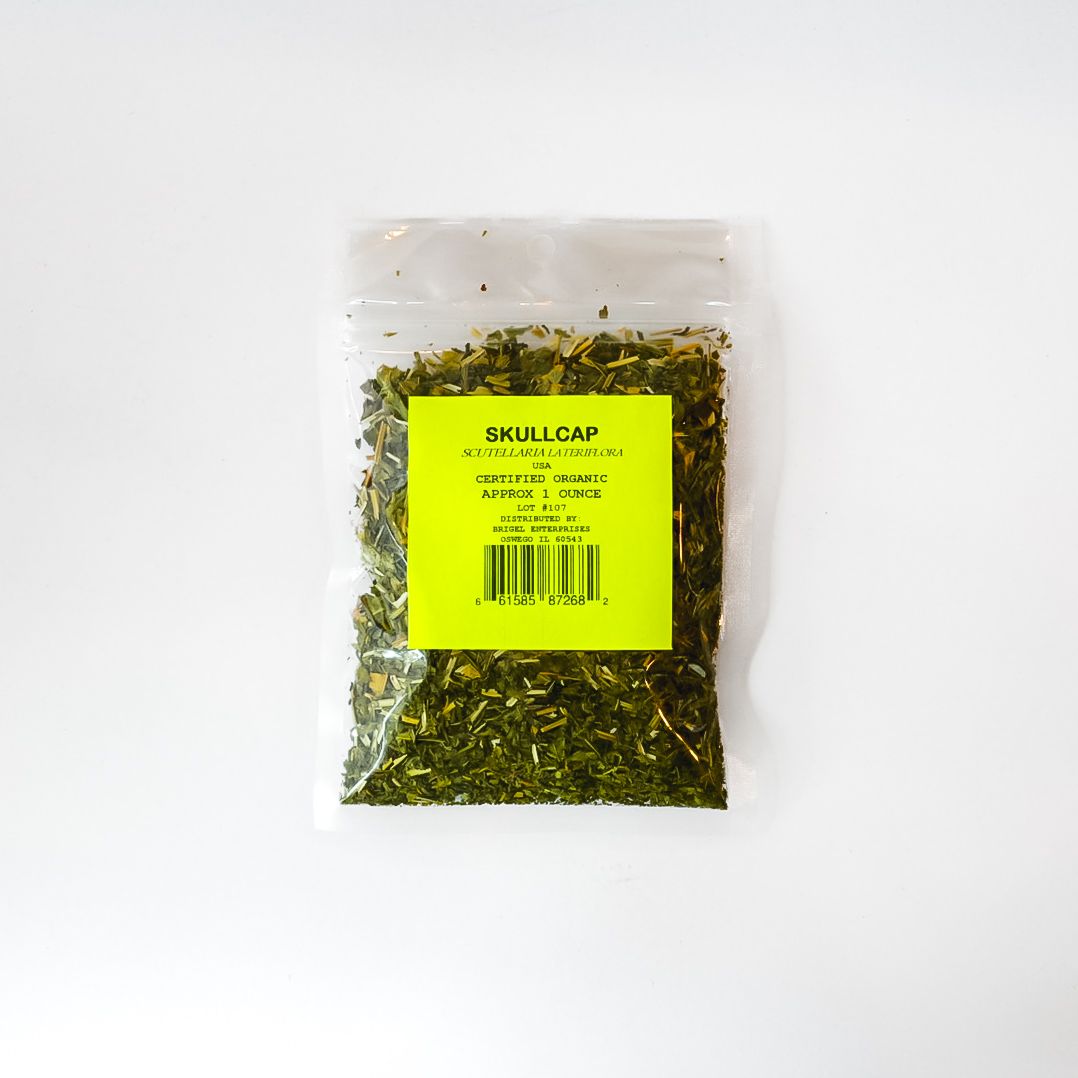 Clear bag of dried herbs with a bright yellow label on a white background