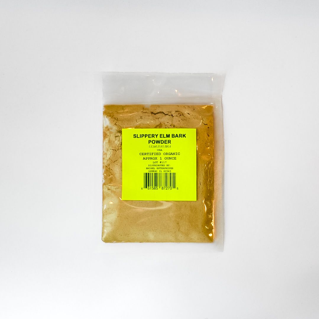 Small clear plastic bag of brownish powder with a bright yellow label on a white background