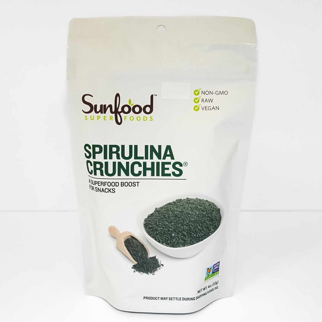 White bag of Sunfood Superfoods Spirulina Crunchies with green product image on the front.