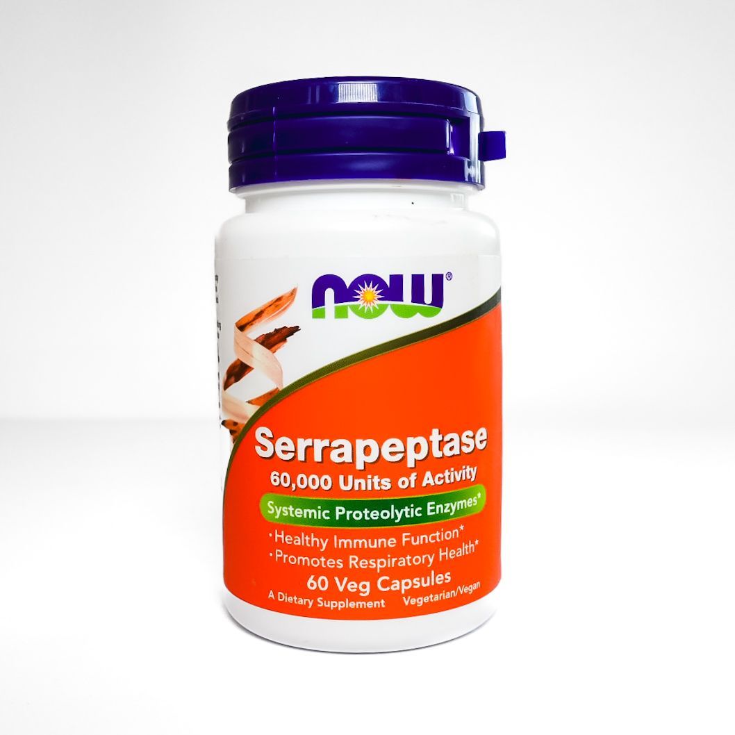 NOW Serrapeptase supplement bottle with purple cap and orange label on white background