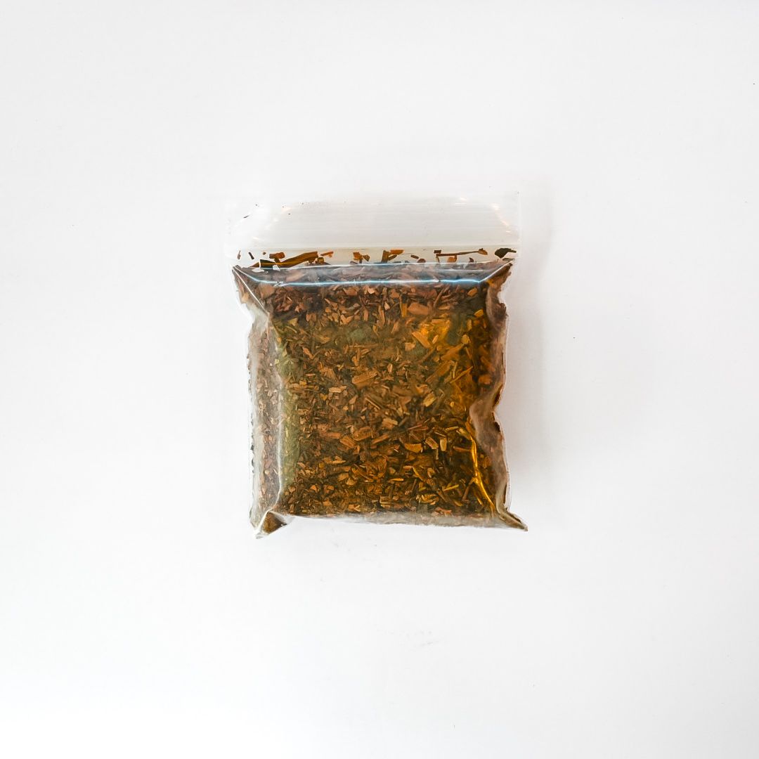Small yellow packet of sarsaparilla root with a barcode on a white background