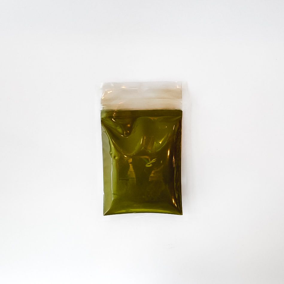 Soursop powder in a small clear plastic pouch with a bright yellow label and barcode