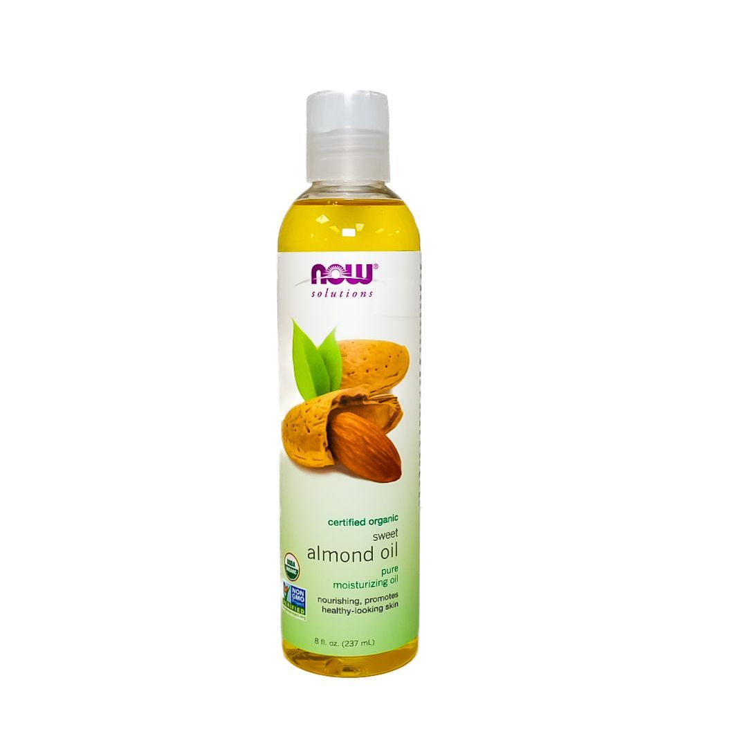 Bottle of almond oil with Arabic label, clear cap, yellow liquid, and almond illustration on white background