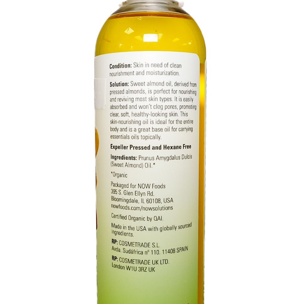 Bottle of almond oil with Arabic label, clear cap, yellow liquid, and almond illustration on white background