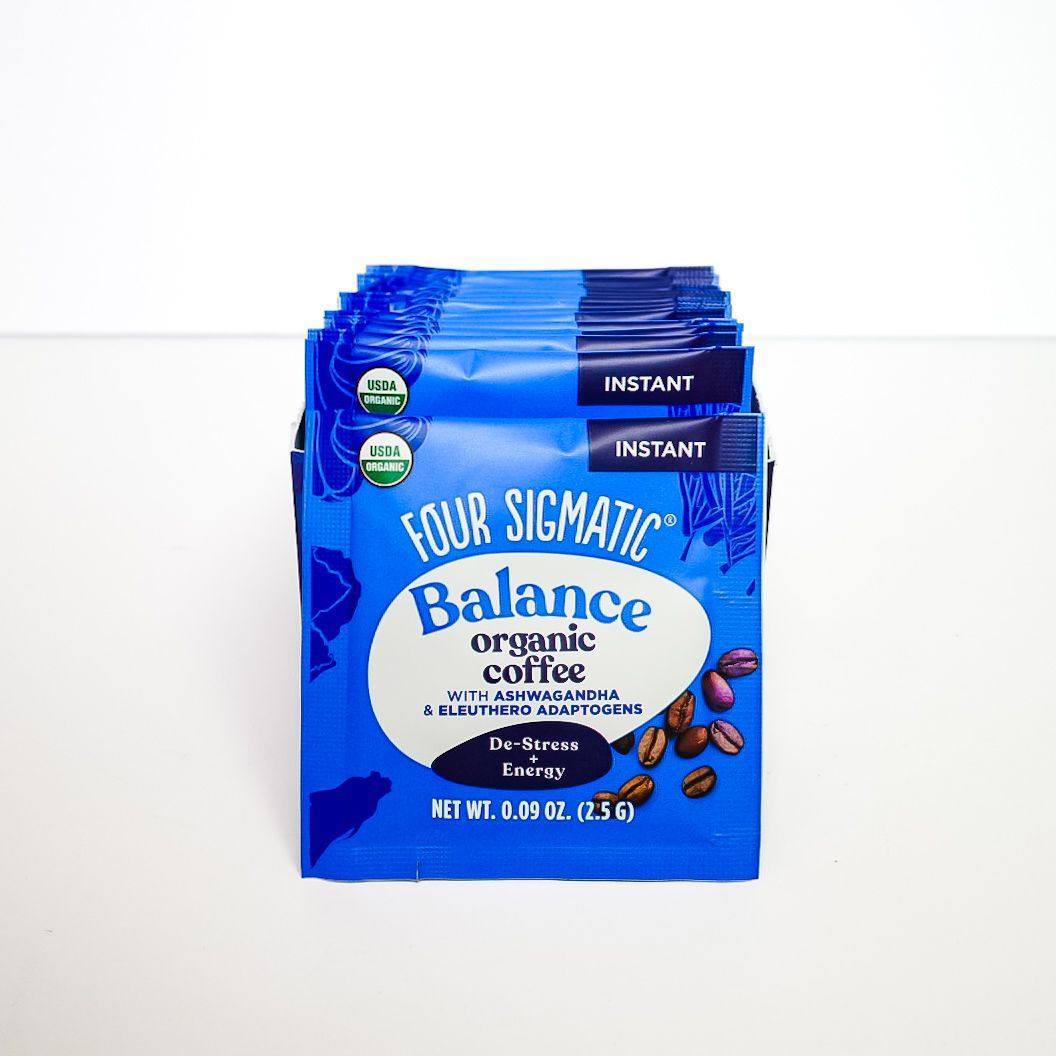 Blue Four Sigmatic Balance organic coffee instant packet with mushrooms on a white background