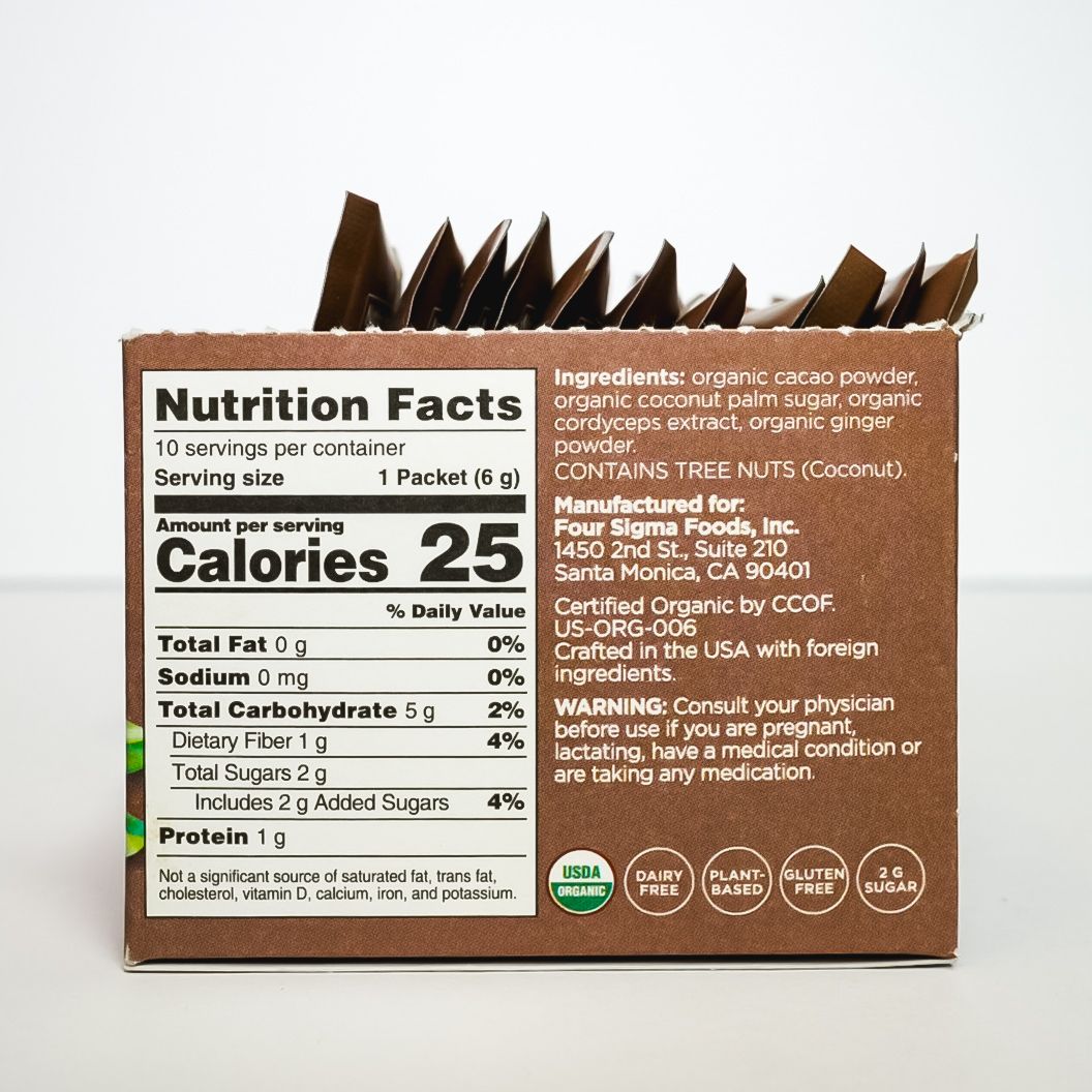 Four Sigmatic Boost organic cacao mix in brown pouch on white background