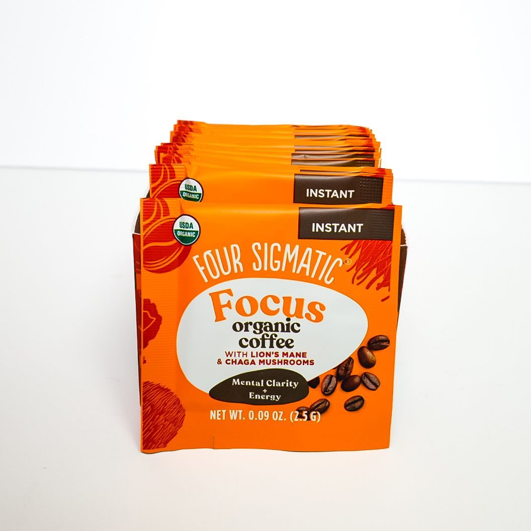 Orange Four Sigmatic Focus organic coffee instant packet on white background