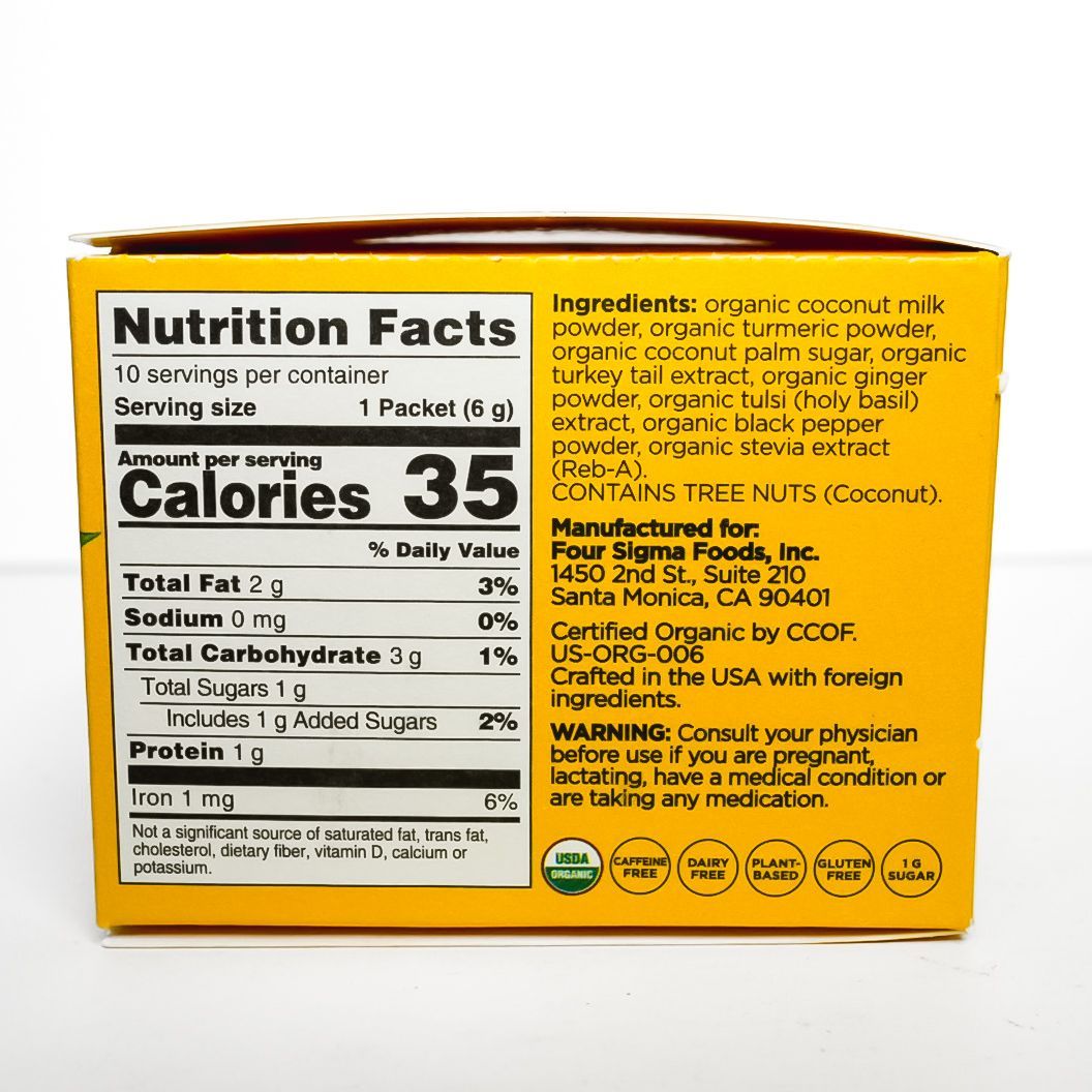 Yellow Four Sigmatic Organic golden latte mix package on a white background