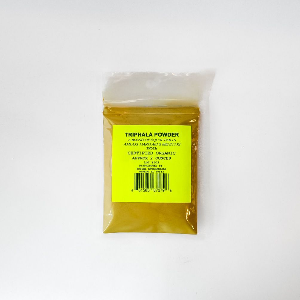 Yellow packet labeled “Triphala Powder” with barcode on a white background
