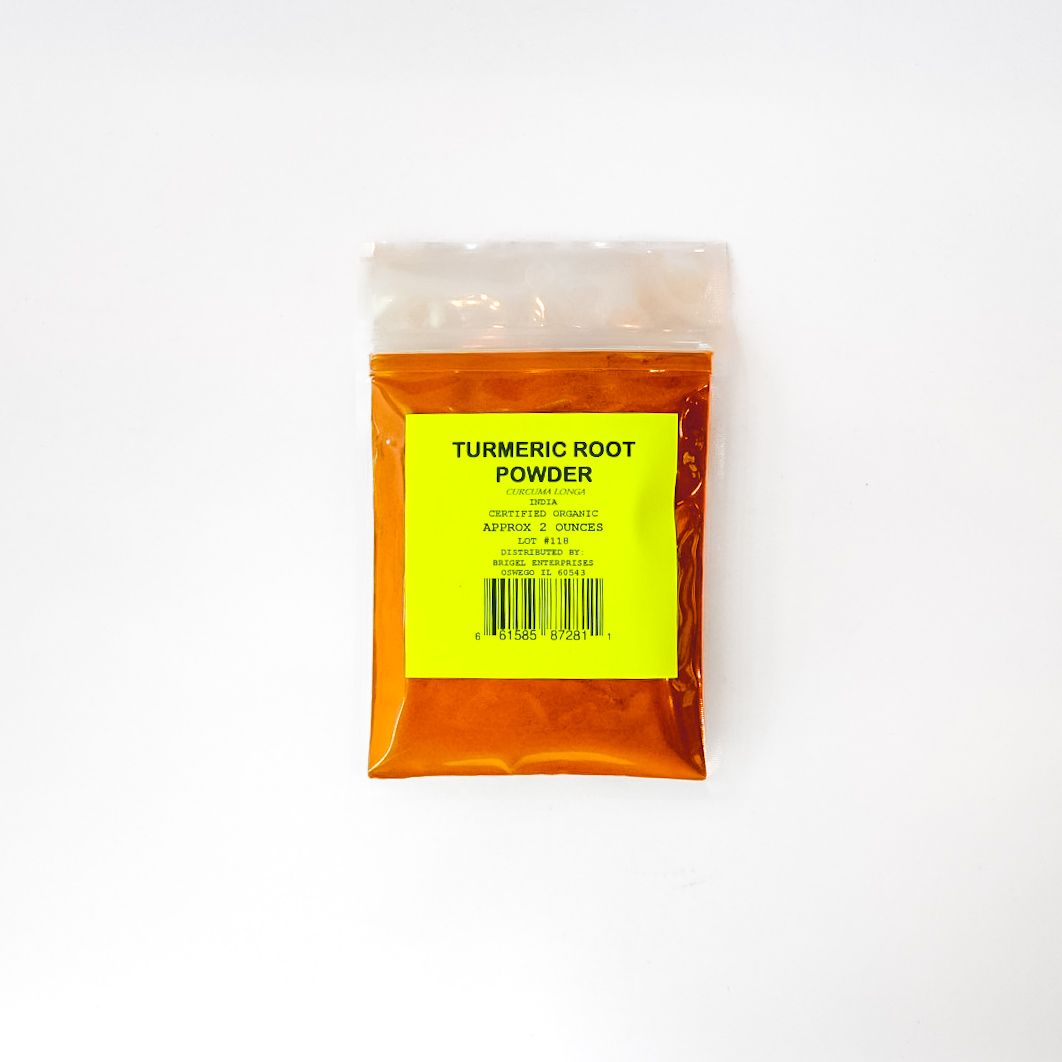 Orange packet of turmeric rhizome powder with a yellow label on a white background
