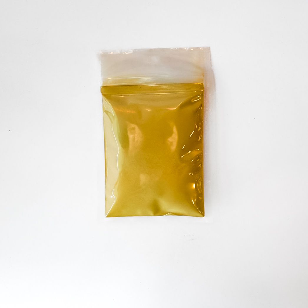 Yellow packet labeled “Triphala Powder” with barcode on a white background