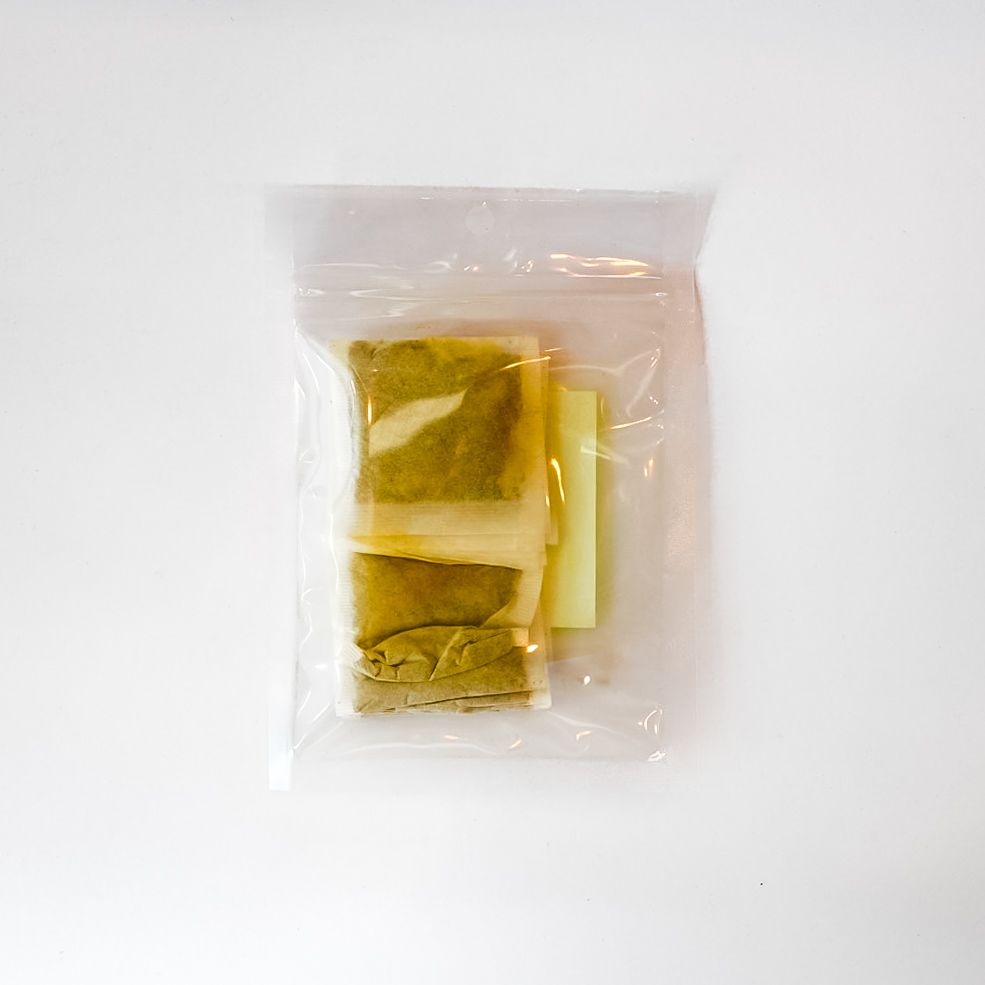 Plastic bag of Turmeric Spice Tea Bags with bright yellow label on a white background