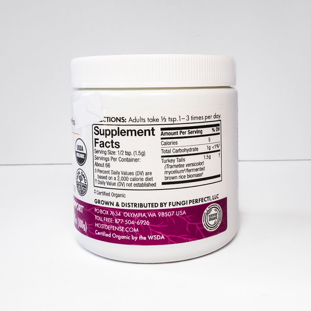 White jar of Host Defense Turkey Tail mushroom supplement on a light background