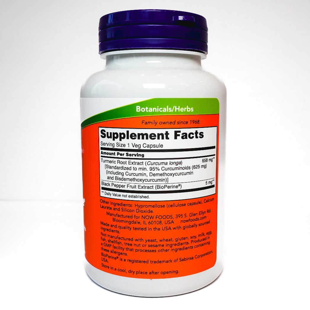 White medicine supplement bottle with purple cap and label text on a plain background