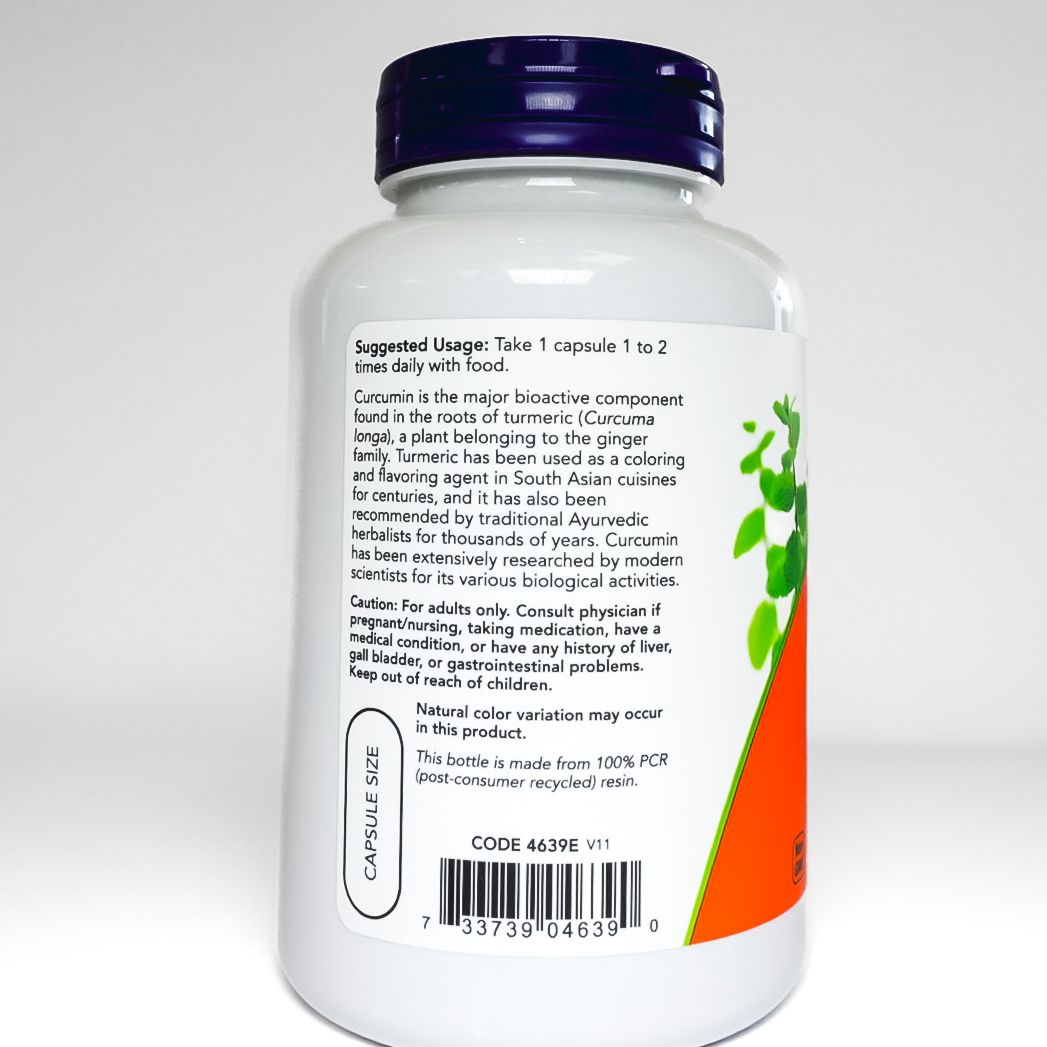 NOW Turmeric Curcumin supplement bottle with orange label and purple cap on white background