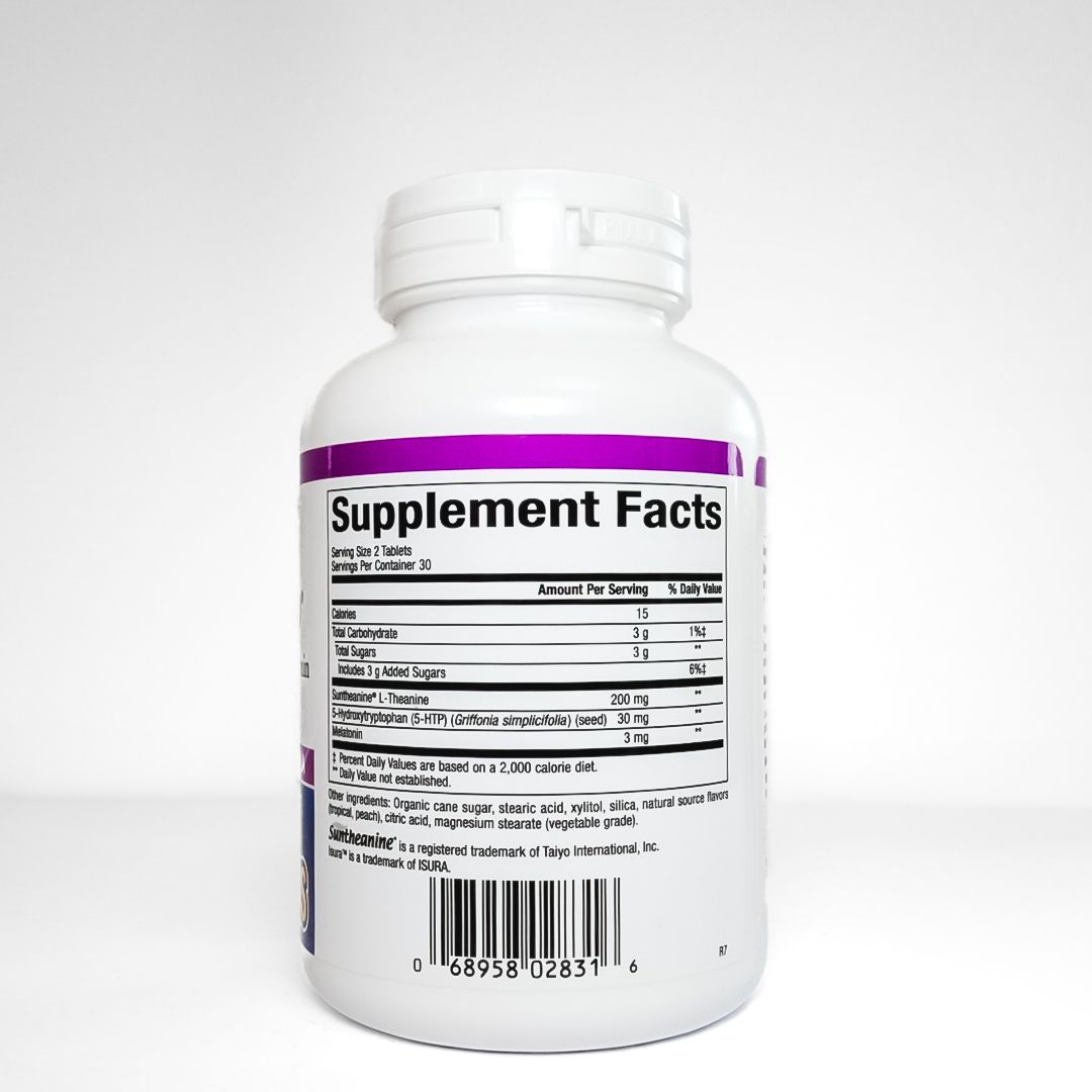 White bottle of Natural Factors Tranquil Sleep dietary supplement tablets on a light background