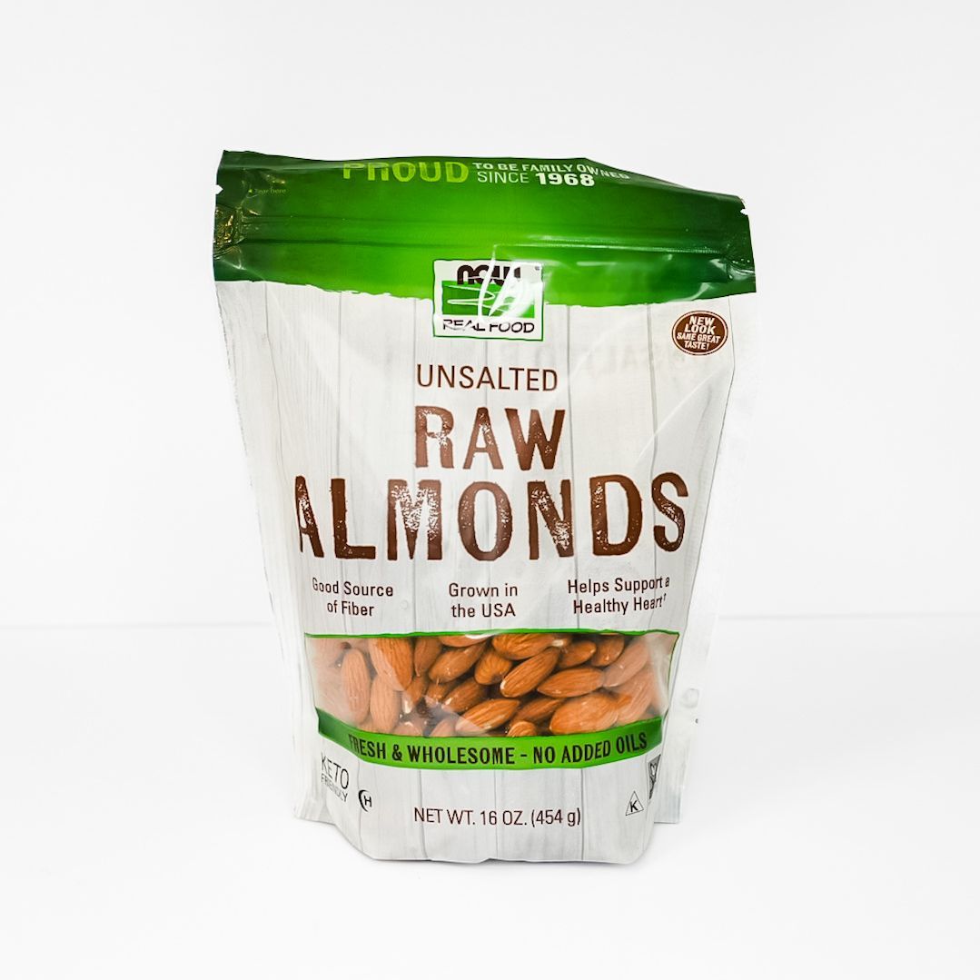 Green-and-white bag of unsalted raw almonds with visible nuts on the front.