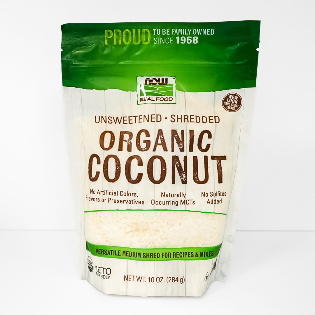 Front of a green-and-white bag of organic unsweetened shredded coconut