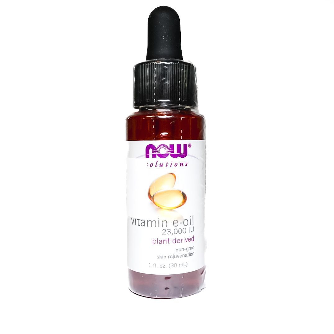 NOW Vitamin E Oil dropper bottle with amber liquid on white background