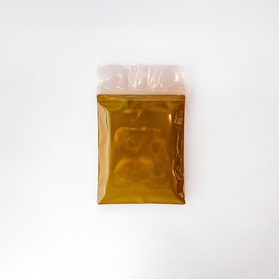 Small yellow snack packet with a clear top on a white background