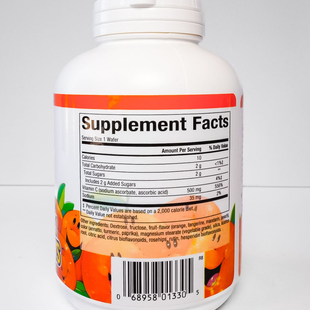 Orange-flavored fruit chew supplement bottle with “C 500 mg” label on white background