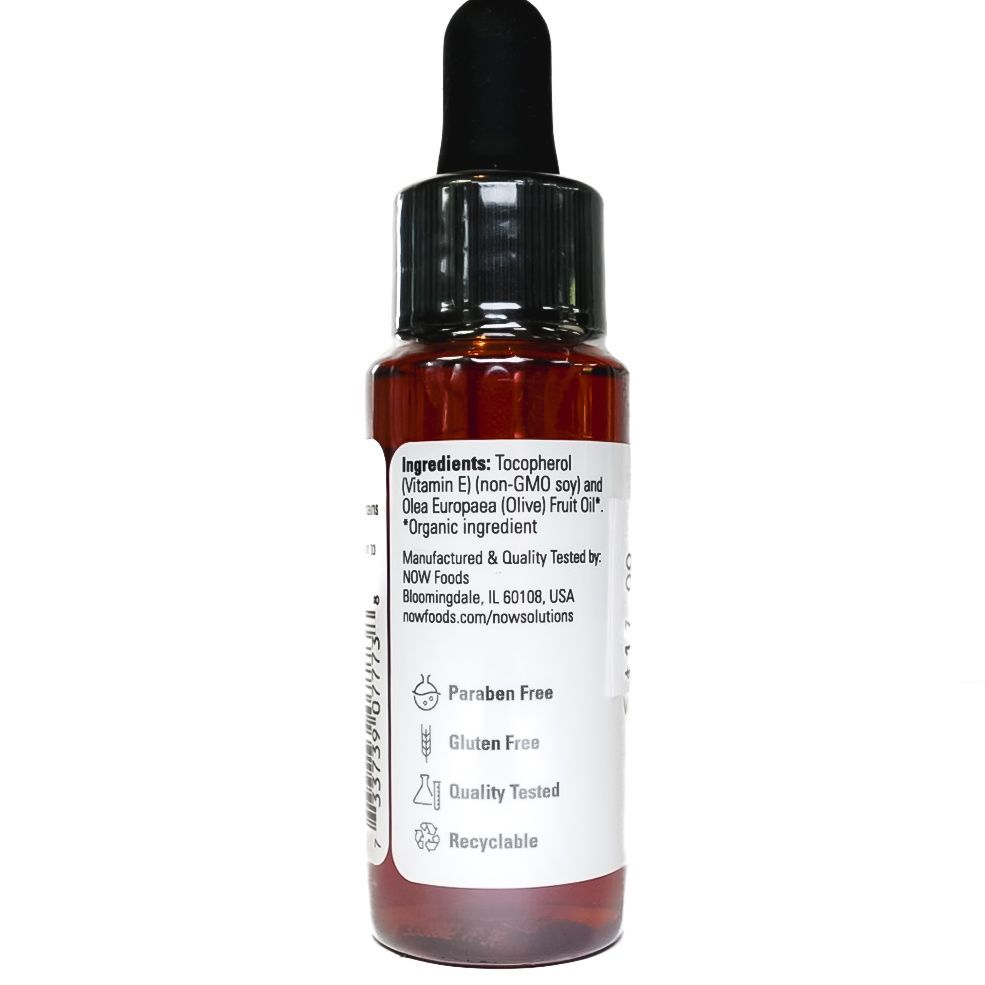 NOW Vitamin E Oil dropper bottle with amber liquid on white background