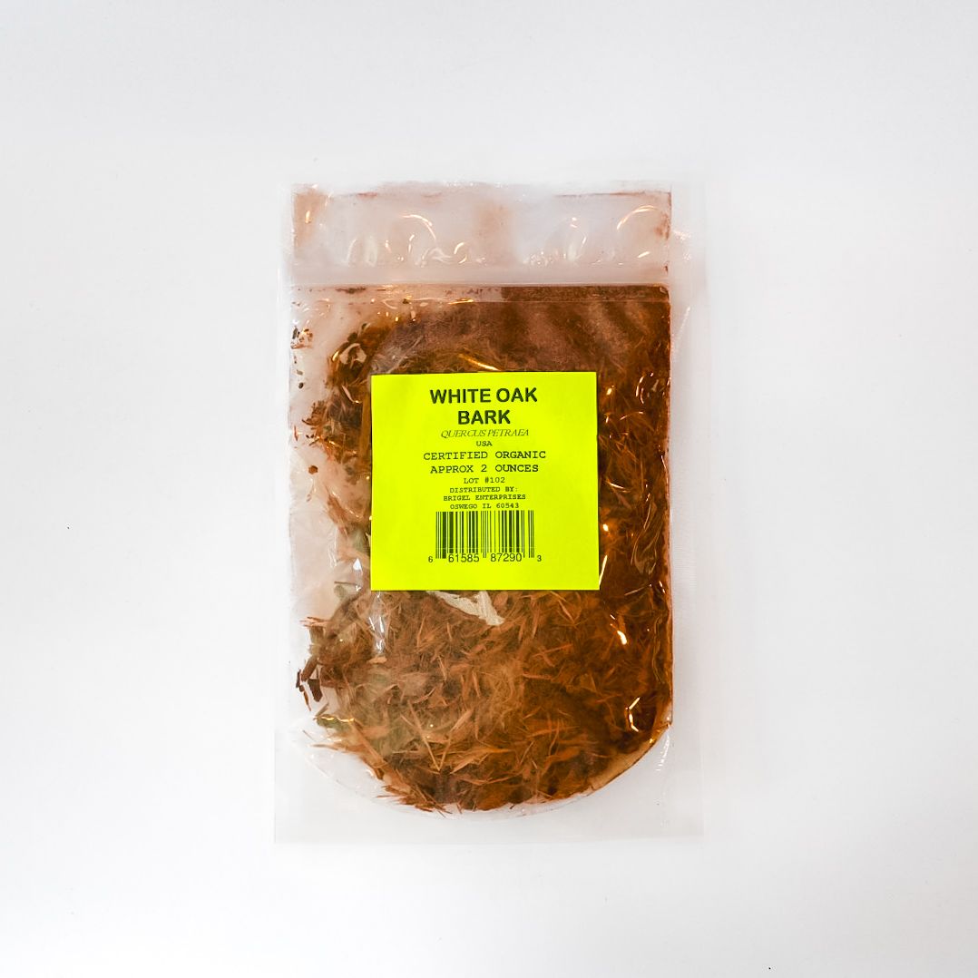 Clear bag of bark chips with a bright yellow label on a white background