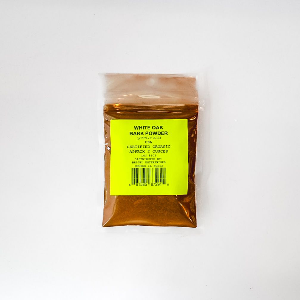 Clear plastic bag of white oak tan powder with yellow label on a white background