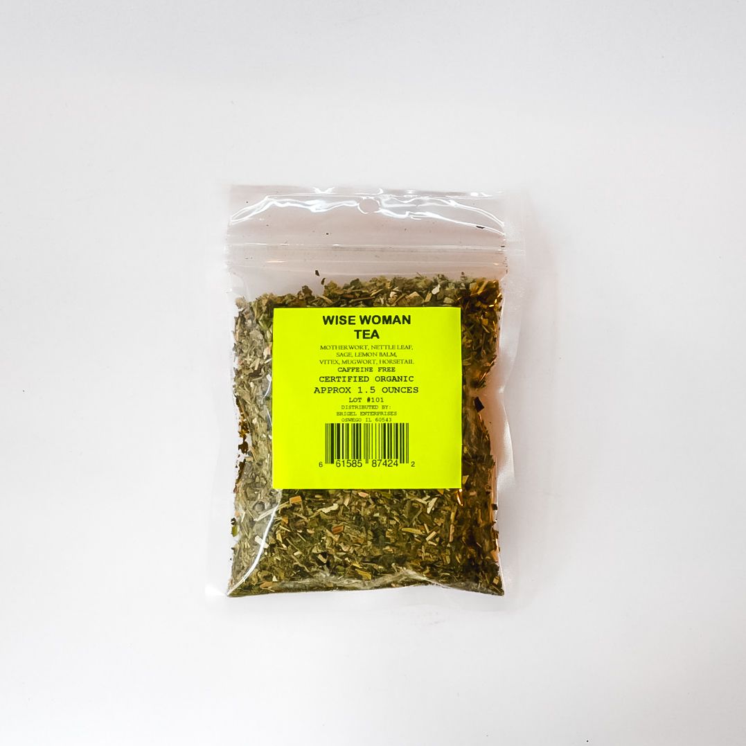 Small clear plastic bag of dried herbs with a bright yellow label on a white background