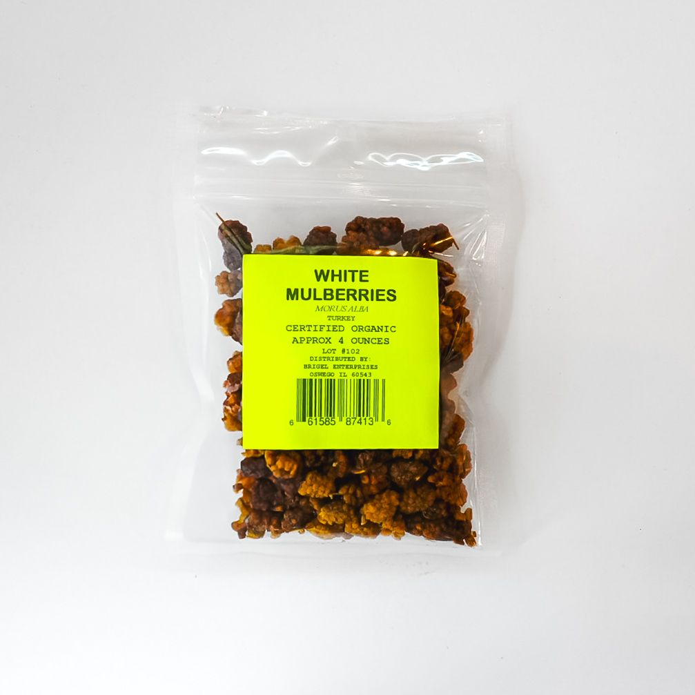 Clear plastic bag of dried white mulberries with a bright green label on a white background