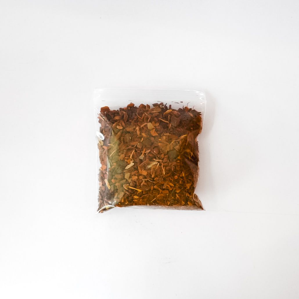 Packaged wild cherry bark in a clear plastic bag with a bright yellow label on a white background