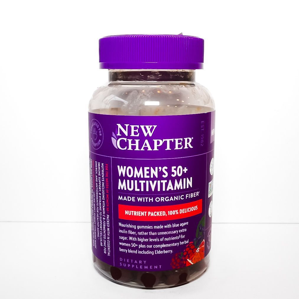 Purple New Chapter Women’s 50+ multivitamin bottle with orange capsules on white background