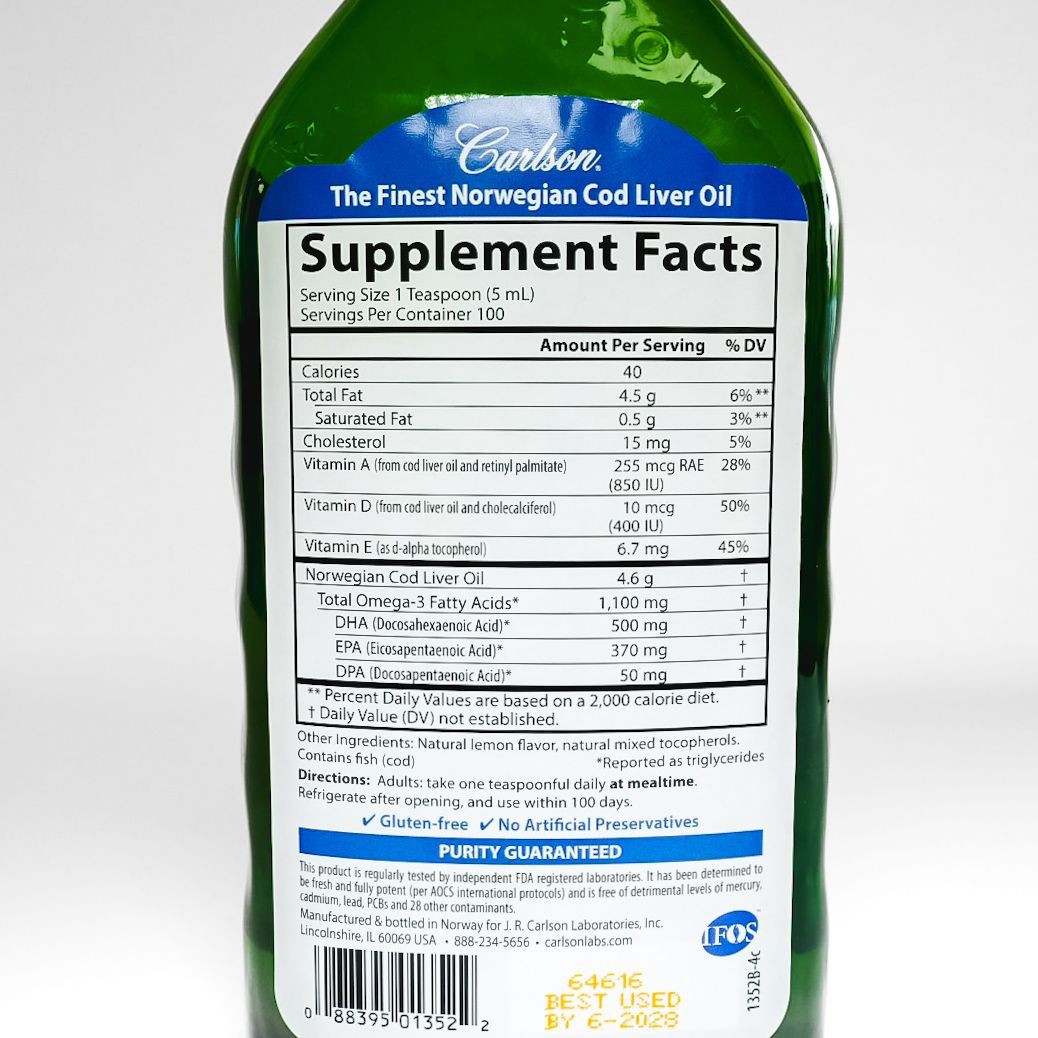 Bottle of Cod Liver Oil with green glass and blue label on a white background