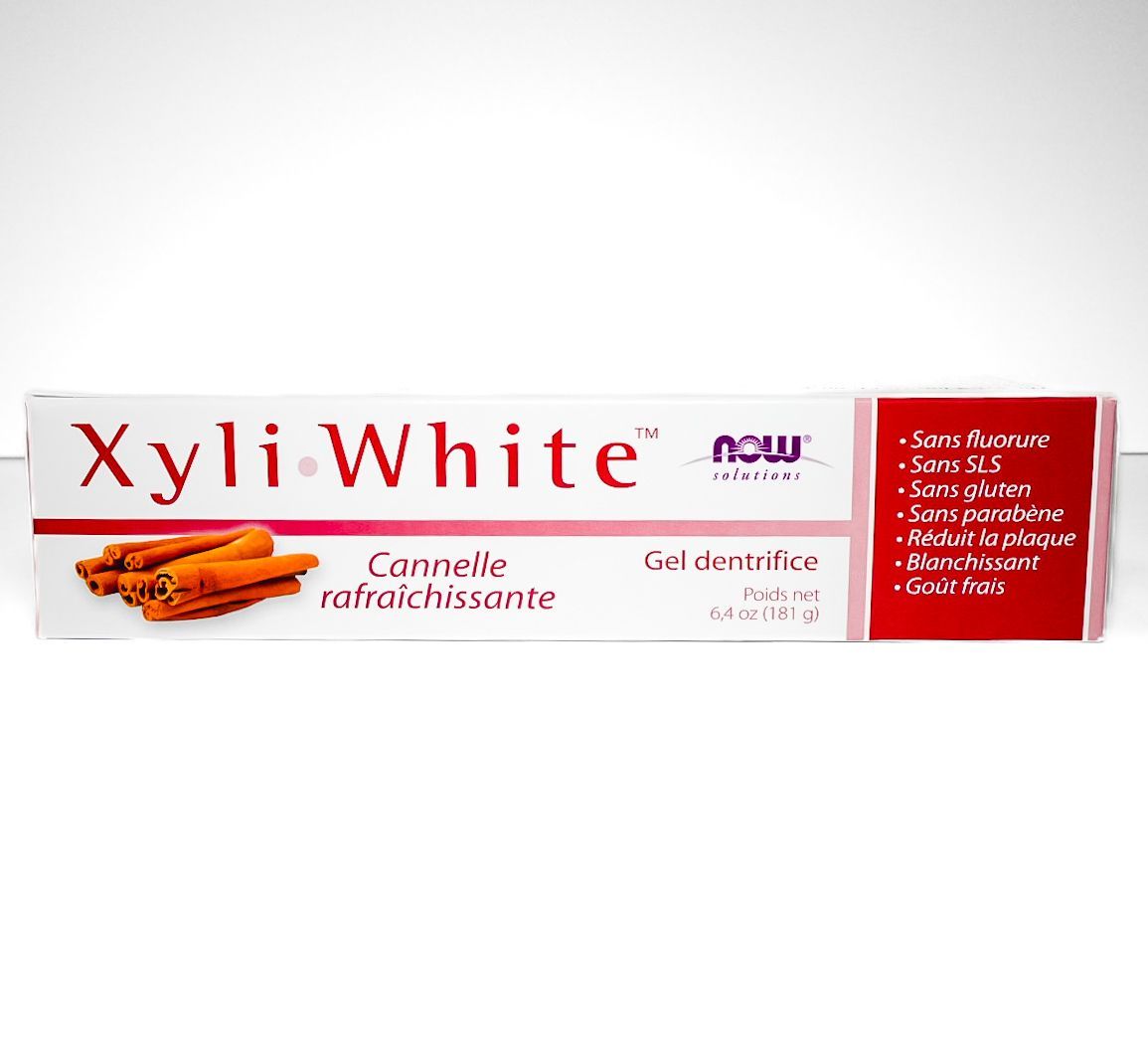 XyliWhite toothpaste box with red and white packaging and cinnamon stick image