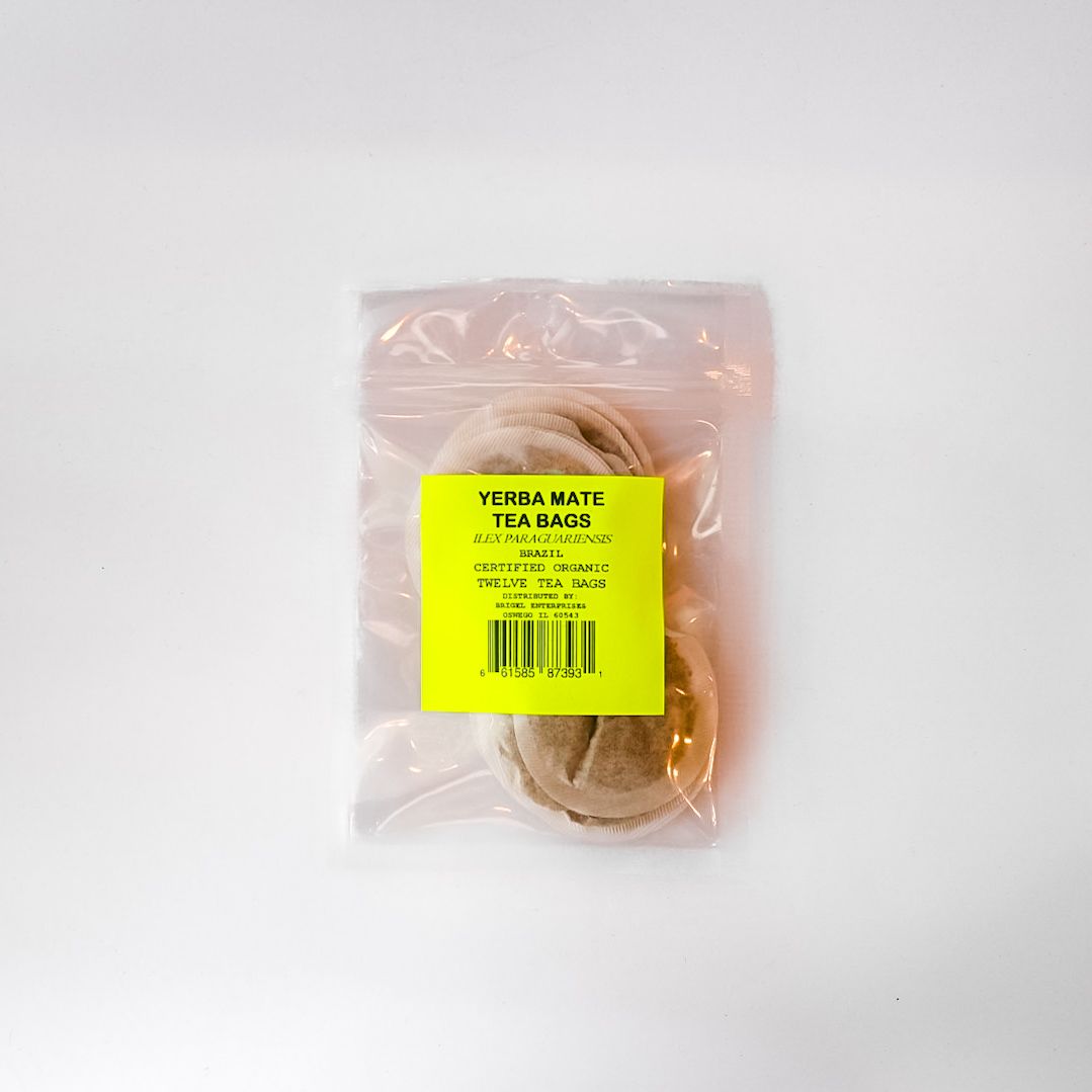 Clear plastic bag with a yellow label containing a tan round object on a white background
