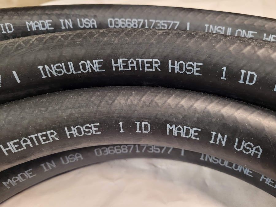 Black rubber heater hose coils with white printed text: “INSULONE HEATER HOSE,” “1 ID,” and “MADE IN USA.”