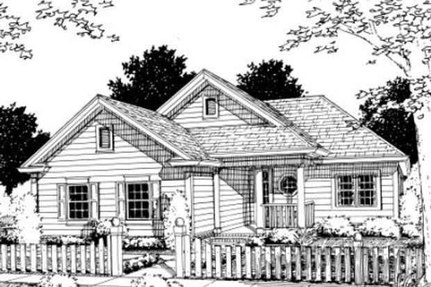 Cottage-style house with white picket fence, porch, and gabled roof, set in a landscaped yard.