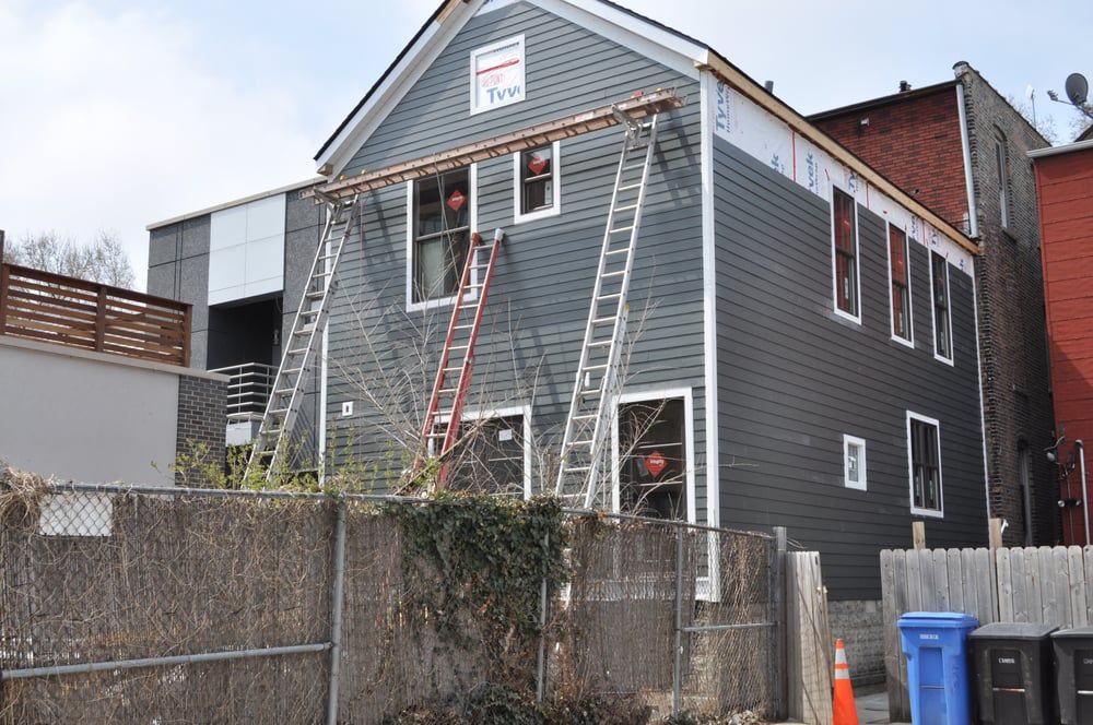 A house with a ladder on the side of it