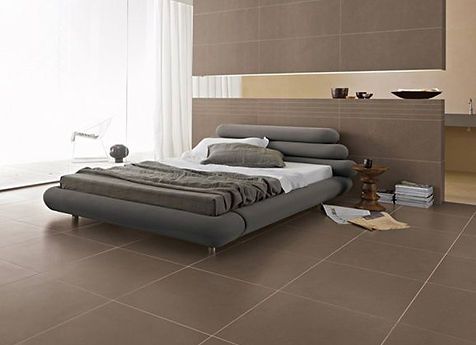 There is a bed in the middle of the room