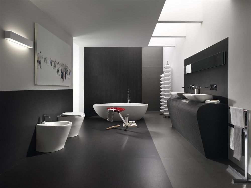 A bathroom with a bathtub and two sinks