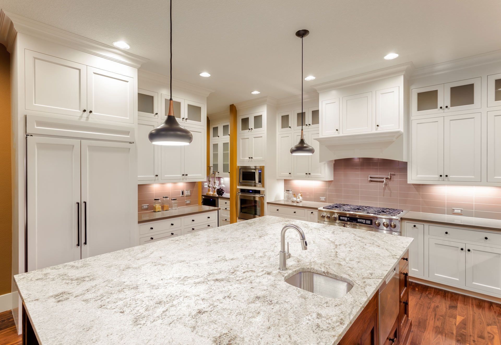 There is a large island in the middle of the kitchen