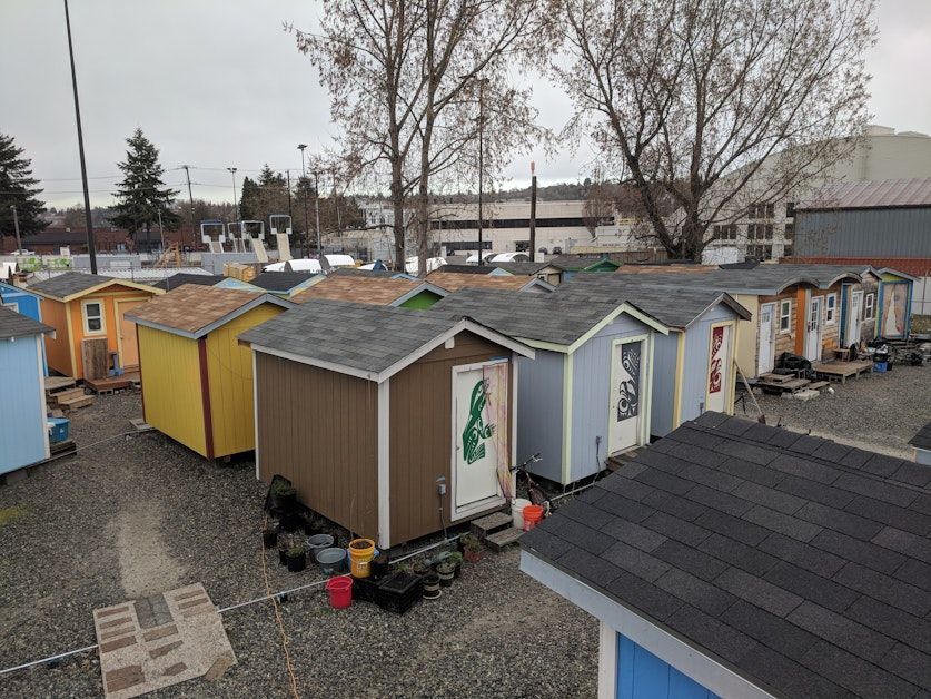 Tiny homes at a local Seattle micro-shelter village, representing a community-supported housing program for the holidays.