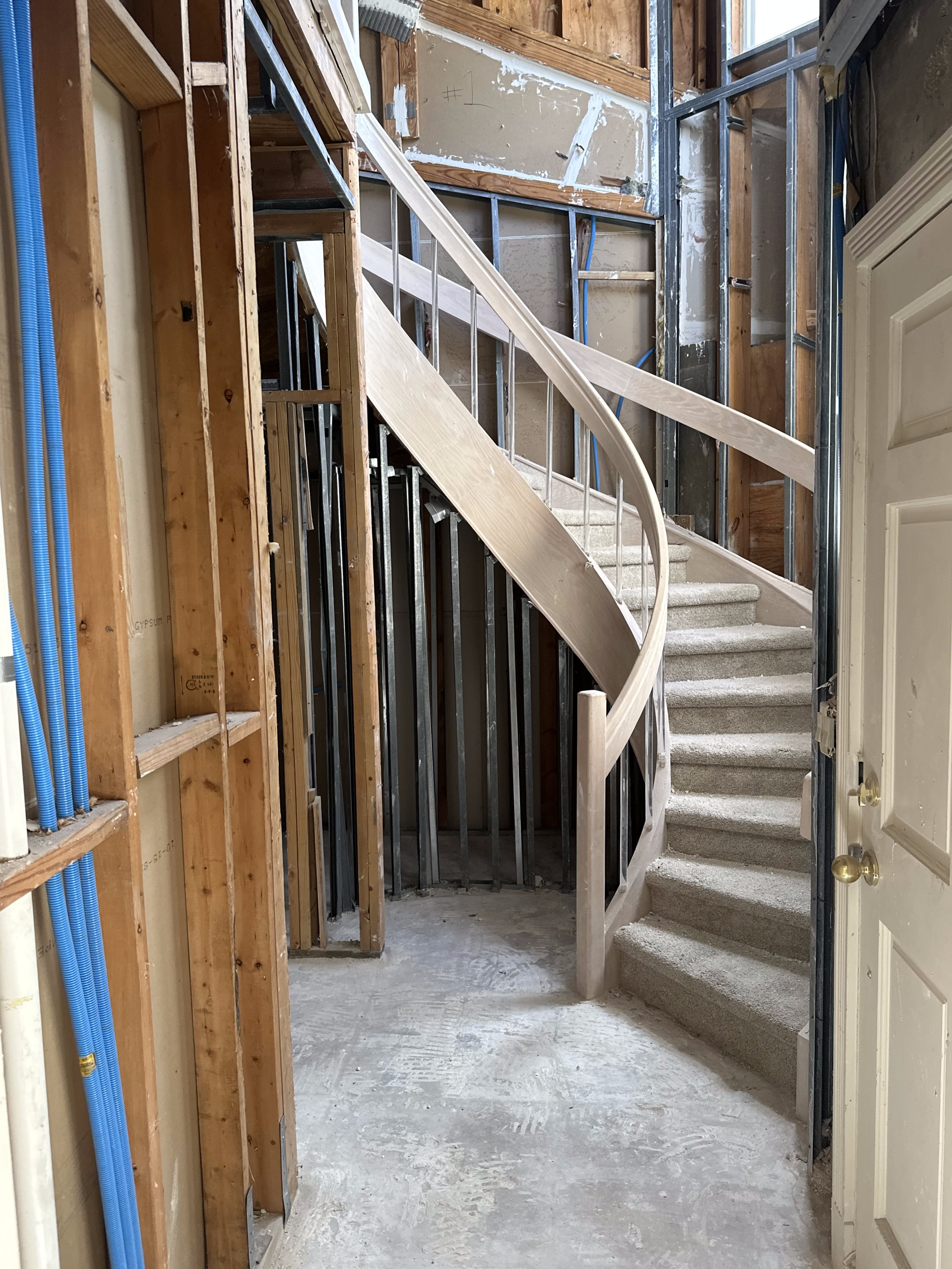 A spiral staircase in a building under construction