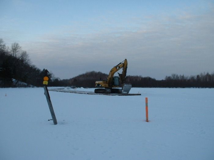 2-3-2010 Setting the roadway onto the ice at the south end of the channel.