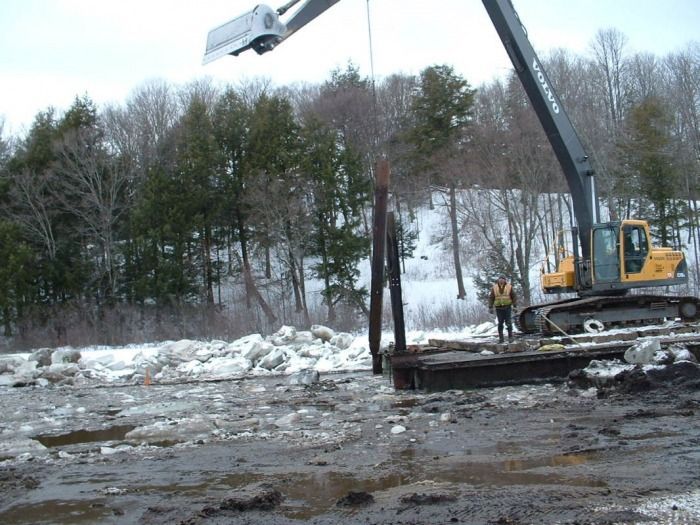 2-17-2010 Piling used to hold barge in place while dredging.