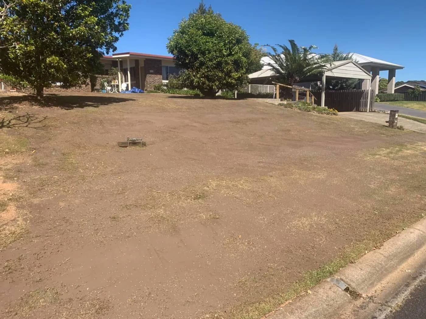 There Is a House in The Background and A Lot of Grass in The Foreground — All Round Ground Maintenance in Grafton, NSW