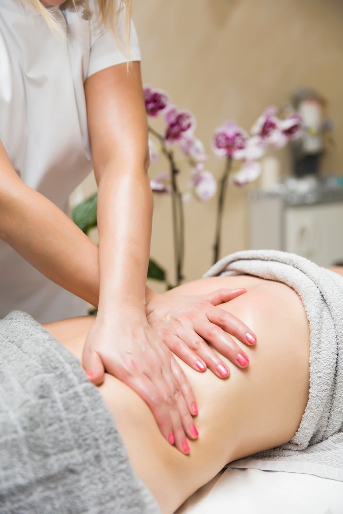 Massage Therapist Giving a Client a Back Massage in a Spa Setting — Sage Spa & Beauty in Mackay, QLD