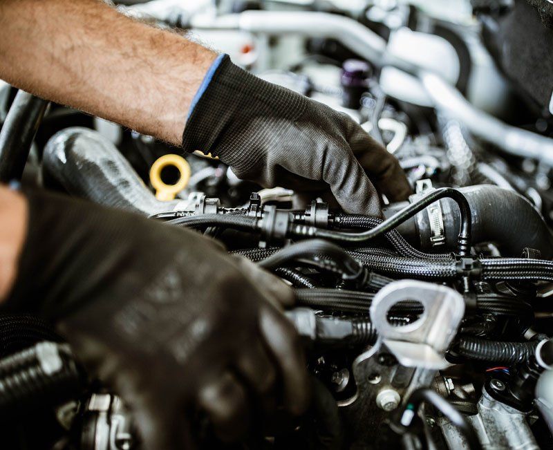 Close Up of a Mechanic Examining Car Pump in a Workshop — Tasmania — Statewide Turbo’s & Diesel Injection Close Up of a Mechanic Examining Car Pump in a Workshop — Tasmania — Statewide Turbo’s & Diesel Injection