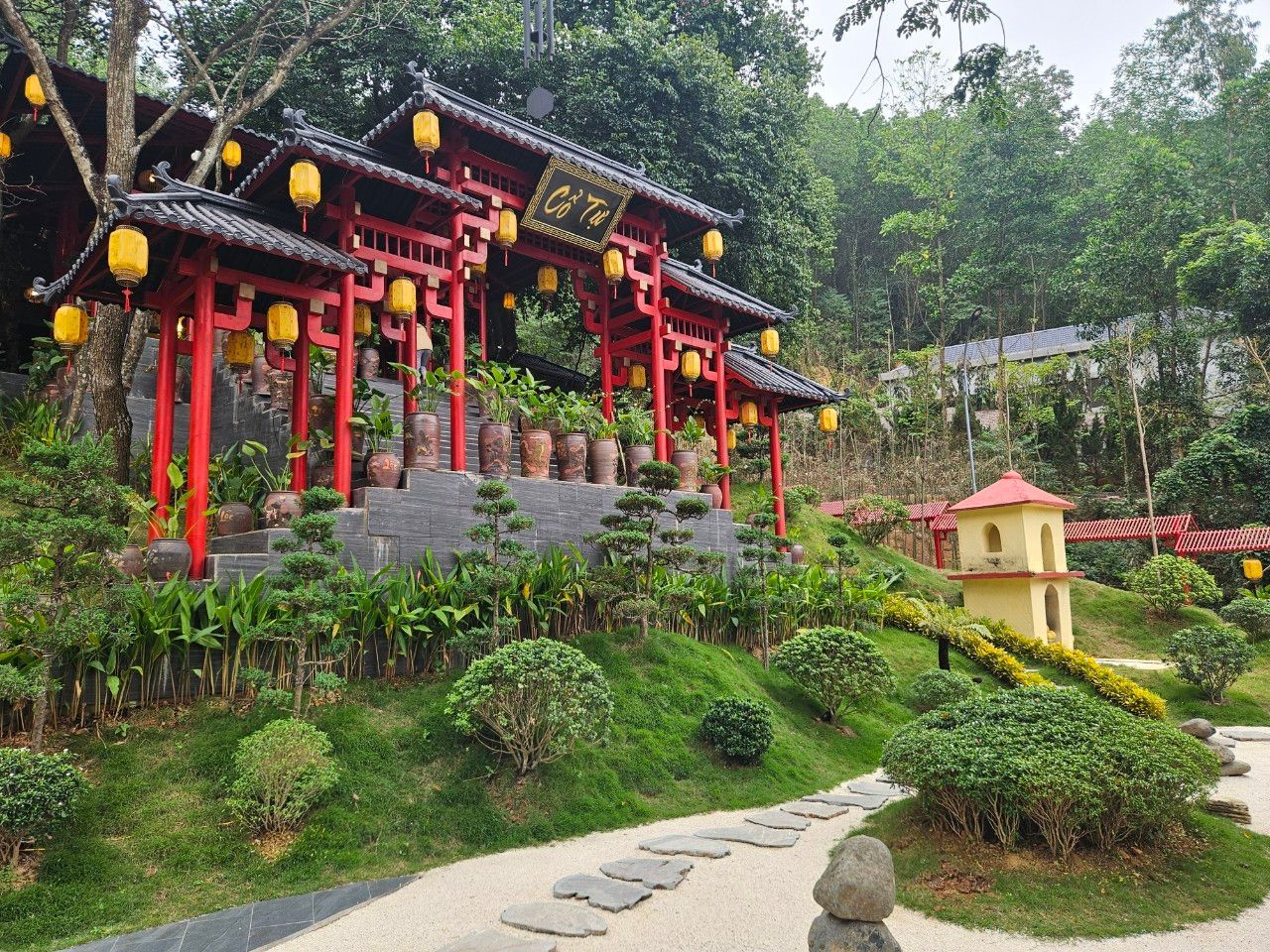 Cay Thi Pagoda with its traditional architecture, surrounded by tranquil greenery in Vietnam.